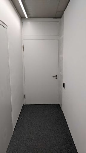 White door in white hallway
